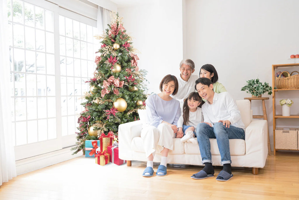 family-striking-a-pose-beside-christmas-tree