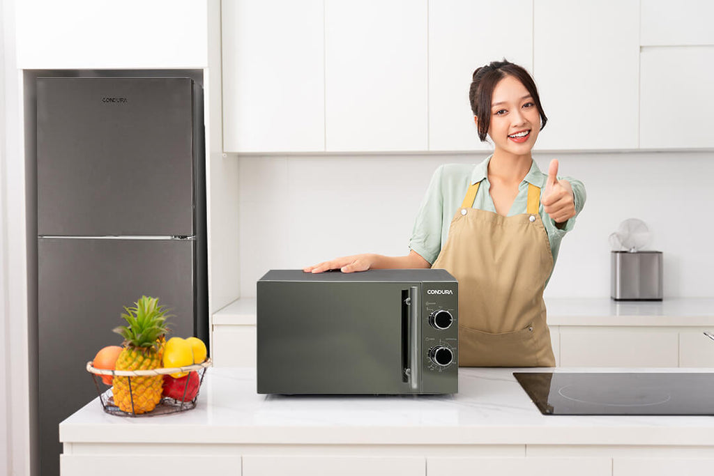 microwave-with-a-woman-posing-a-thumbs-up-sign